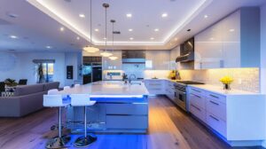 a sleek, contemporary kitchen island stands at the center of a modern kitchen remodel, showcasing innovative design elements like integrated smart technology and elegant finishes under bright, focused lighting.